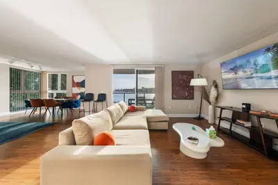 a living room with a couch and a table at Azure Marina Luxe - Waterfront with Sunset Views in Los Angeles