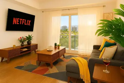 a living room with a couch and a table at High stay, new furniture apartment in Glendale