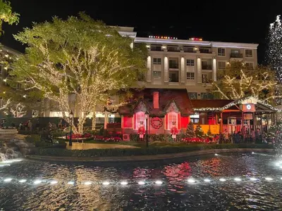 a hotel with christmas lights in front of a building at High stay, new furniture apartment in Glendale