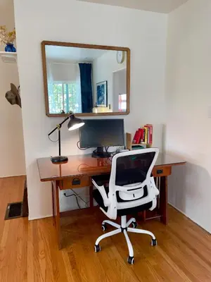 a desk with a computer and a chair and a mirror at Pasadena Quiet Gem with Fiber Internet WiFi and Workspace in Pasadena