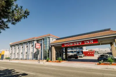 a county line store on the corner of a street at Downey Inn in Downey