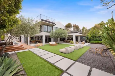 an image of a house with a garden at The Colony Reserve by Stay Awhile Villas in Malibu Beach