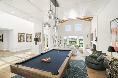 a living room with a pool table in it at Villa Azure - by Stay Awhile Villas in Malibu