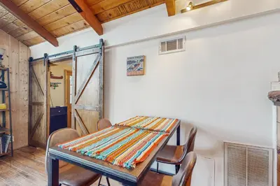 a dining room with a table and chairs at Couples Retreat Near Lake Arrowhead and Hiking! in Lake Arrowhead