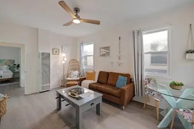 a living room with a couch and a table at At Hermosa Ave and Pier ave- B in Hermosa Beach