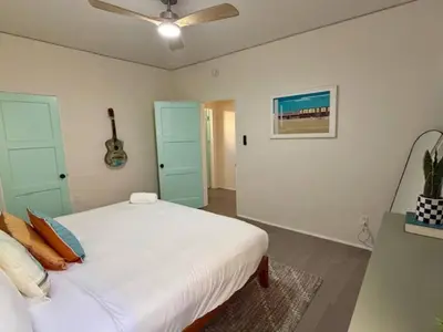 a bedroom with a bed and a ceiling fan at At Hermosa Ave and Pier ave- B in Hermosa Beach