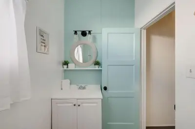 a bathroom with a white sink and a mirror at At Hermosa Ave and Pier ave- B in Hermosa Beach