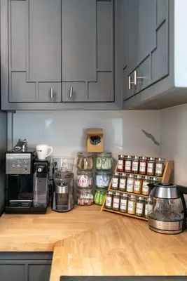 a kitchen with a counter top with jars of food at New Listing City Bungalow by Colby & Conrad in Los Angeles