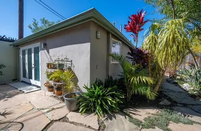 a small house with plants in front of it at Venice Beach Cottage Retreat in Los Angeles