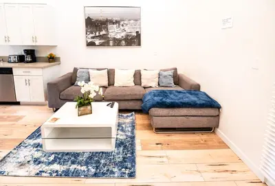 a living room with a couch and a coffee table at Modern 1-Bedromm Loft In Hollywood With Viwe of Hollywood Sign in Los Angeles