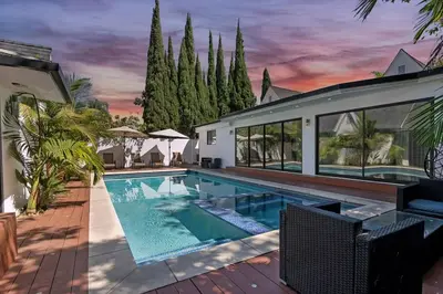 a swimming pool in the backyard of a house at Mansfield Modern in Los Angeles