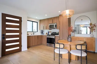 a kitchen with a table and chairs in a kitchen at New Venice Beach Zen Hideaway in Los Angeles