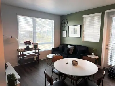 a living room with a table and a couch at 242 Charming, Peaceful Apartment Retreat in Griffith in Glendale