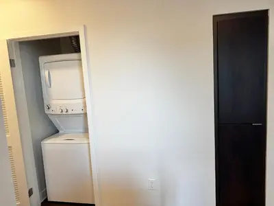 a small kitchen with a microwave and a refrigerator at 242 Charming, Peaceful Apartment Retreat in Griffith in Glendale