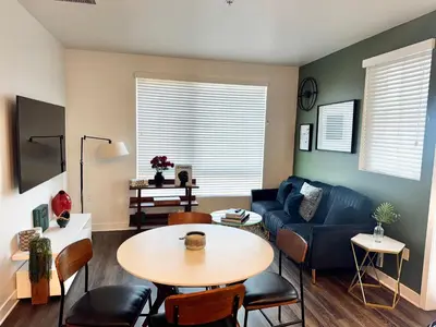 a living room with a table and a couch at 242 Charming, Peaceful Apartment Retreat in Griffith in Glendale