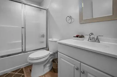 a bathroom with a toilet and a sink and a shower at Loft-Style 1-Bedroom Apartment with Balcony & Private Parking in Hollywood in Los Angeles