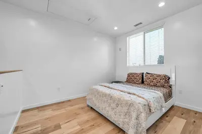 a bedroom with a bed and a window at Lux Hollywood Loft 1BR with Balcony & Private Parking 10 Min to Downtown LA in Los Angeles