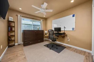 a room with a desk with a computer and a window at KingBeds Skylight 1GB Wi-Fi Step-free Clean in Bakersfield