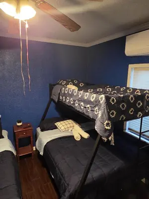 a bedroom with two bunk beds and a ceiling at Entire Front House in Los Angeles in Los Angeles