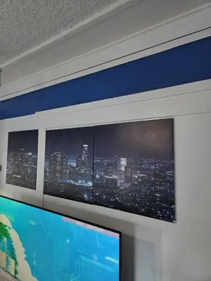 a flat screen tv hanging on a wall at Entire Front House in Los Angeles in Los Angeles