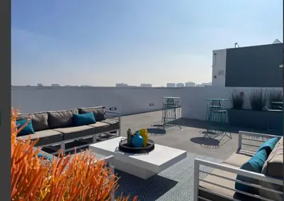 a patio with couches and tables on a rooftop at LAX 1 Bed Luxe with FREE PARKING in Los Angeles