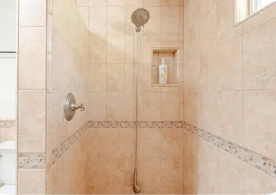a bathroom with a shower with a glass door at Spacious and Exclusive Oasis 6BR 3BA in Thousand Oaks