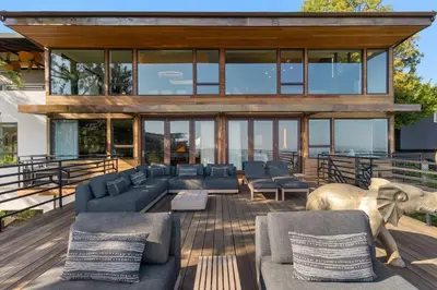 a house with a large living room with blue couches at White Lotus by Stay Awhile Villas in Los Angeles