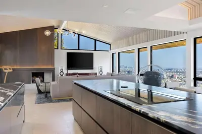 a kitchen and living room with a view of the city at White Lotus by Stay Awhile Villas in Los Angeles