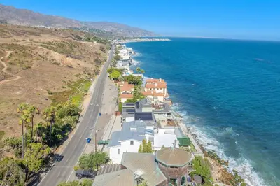 an aerial view of a beach with houses and the ocean at Casa Mare by Stay Awhile Villas in Malibu Beach