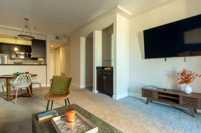 a living room with a tv and a table at Marvelous 2BR 2BA Apartment in Los Angeles