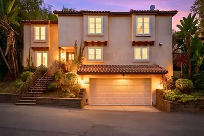 a large house with a garage in front of it at Allura Studio City Mediterranean with Private Pool in Los Angeles