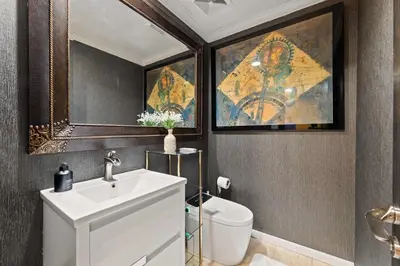 a bathroom with a sink and a toilet at Allura Studio City Mediterranean with Private Pool in Los Angeles