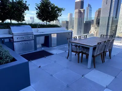 a kitchen with a table and a stove and chairs at Luxury Vacation Resort Studio Downtown LA in Los Angeles