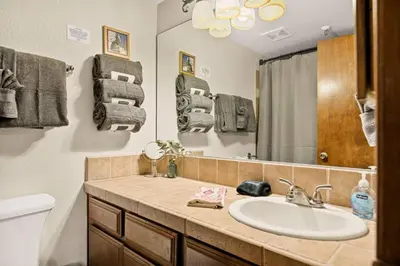 a bathroom with a sink and a mirror at The Pinnacle steps to the ski lifts in Big Bear Lake