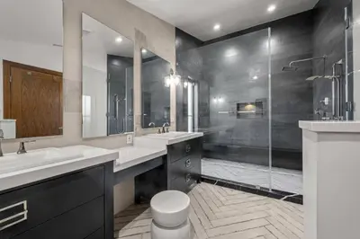 a bathroom with two sinks and a shower at Coulson Street Retreat with pool BBQ and more in Los Angeles