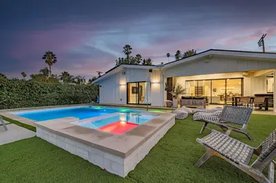 a house with a swimming pool in the yard at Coulson Street Retreat with pool BBQ and more in Los Angeles