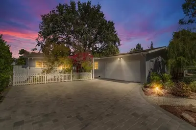 a house with a white fence and a driveway at Peaceful, Los Angeles Family Vacation, Relocation Home in Los Angeles