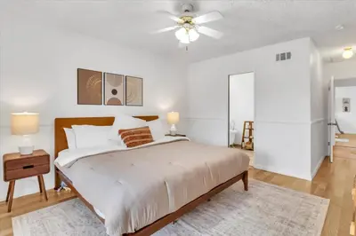 a bedroom with a bed and a ceiling fan at Peaceful, Los Angeles Family Vacation, Relocation Home in Los Angeles