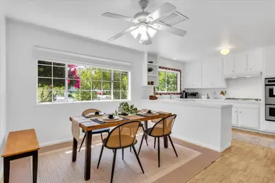 a kitchen with a table and chairs and a ceiling fan at Peaceful, Los Angeles Family Vacation, Relocation Home in Los Angeles