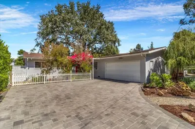 a house with a white fence and a driveway at Peaceful, Los Angeles Family Vacation, Relocation Home in Los Angeles