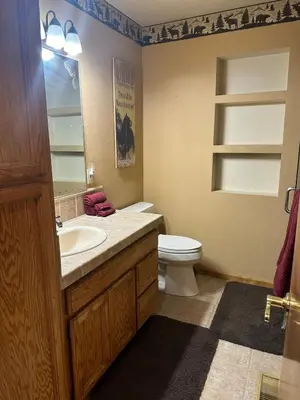 a bathroom with a sink and a toilet in it at Home Sweet Home in Frazier Park