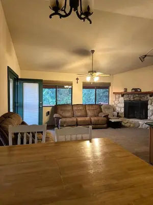 a living room with a couch and a table at Home Sweet Home in Frazier Park