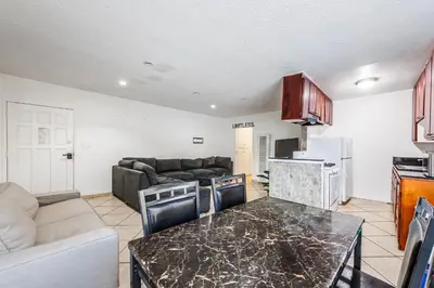 a kitchen and living room with a table and a couch at Excellent 1BD Berryman#10 in Los Angeles