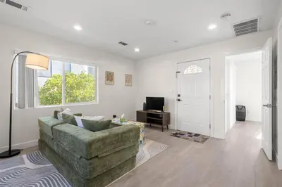 a living room with a couch and a television at Niagara Haven in Burbank