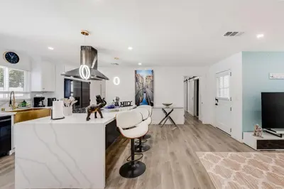 a kitchen with a white island in a room at 4BR Escape - Mtn Views Private BBQ in Thousand Oaks
