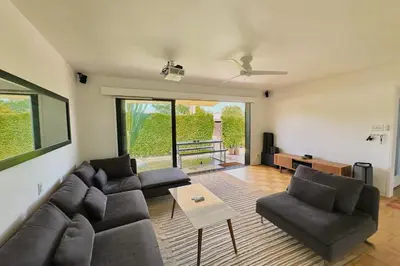 a living room with a couch and a table at Rad Stay Open Concept House in Mar Vista in Los Angeles