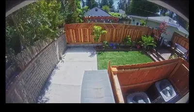 an aerial view of a backyard with a fence at Cheerful house with EV, Parking & backyard in Los Angeles