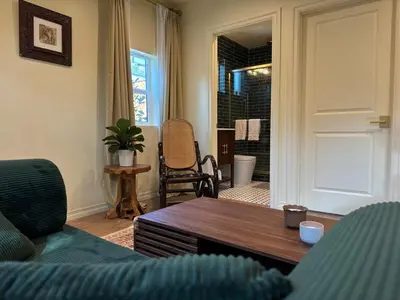 a living room with a couch and a table at The Garden Escape in Los Angeles
