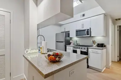 a kitchen with a bowl of fruit on a counter at 2BR Coastal Retreat Walk to Beach, free parking in Los Angeles