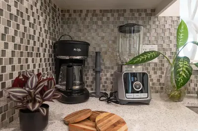 a kitchen counter with a coffee maker and a blender at Hollywood Stars 2 Bedroom Apartment in Los Angeles